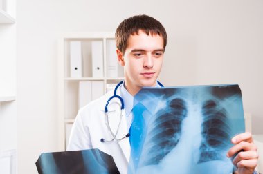 Doctor looking the x-ray clipart