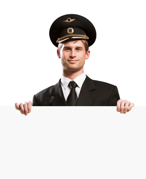 Pilot in the form of holding a blank banner — Stock Photo, Image