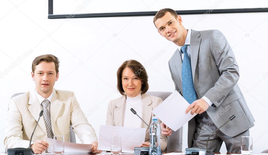 group of business discussing documents
