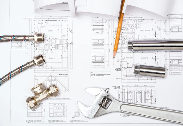 Plumbing and drawings, construction still life — Stock Photo, Image