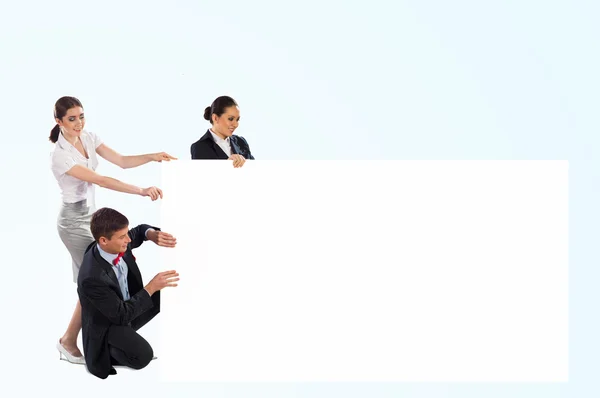 Small group of holding a blank banner — Stock Photo, Image