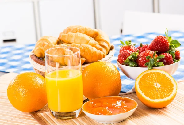 Early breakfast, juice, croissants and jam — Stock Photo, Image