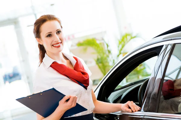 Young woman in a showroom consultant — Stock Photo, Image