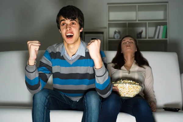 Guy with a passion watching TV — Stock Photo, Image