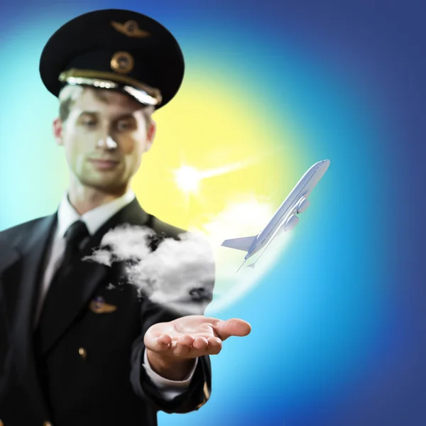 Pilot in the form of extending a hand to airplane — Stock Photo, Image