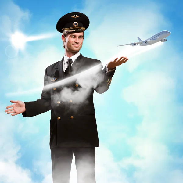 Pilot in the form of extending a hand to airplane — Stock Photo, Image