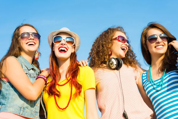 Group of young wearing sunglasses and hat