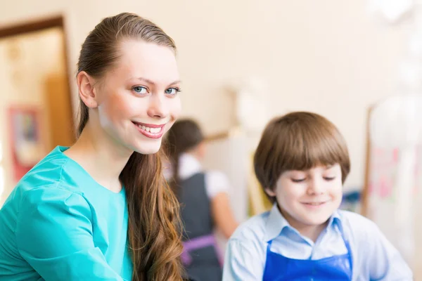Teacher and student in the classroom — Stock Photo, Image