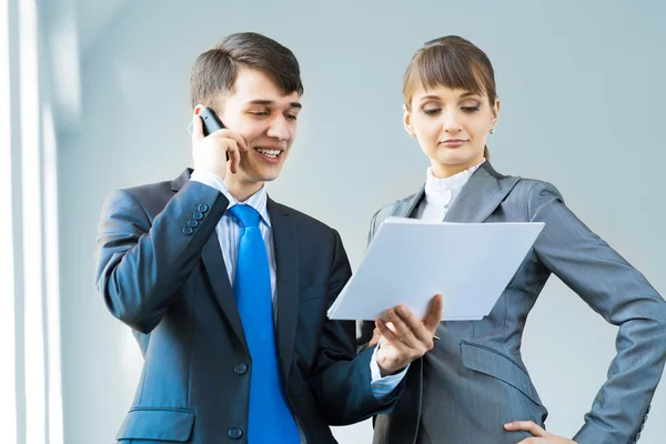 Two business partners discussing reports — Stock Photo, Image