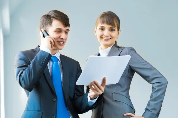 Two business partners discussing reports — Stock Photo, Image