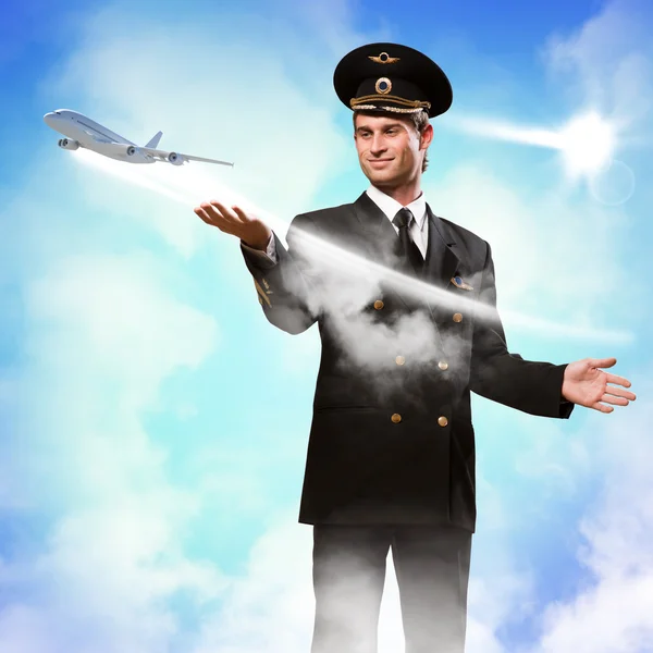 Pilot in the form of extending a hand to airplane — Stock Photo, Image