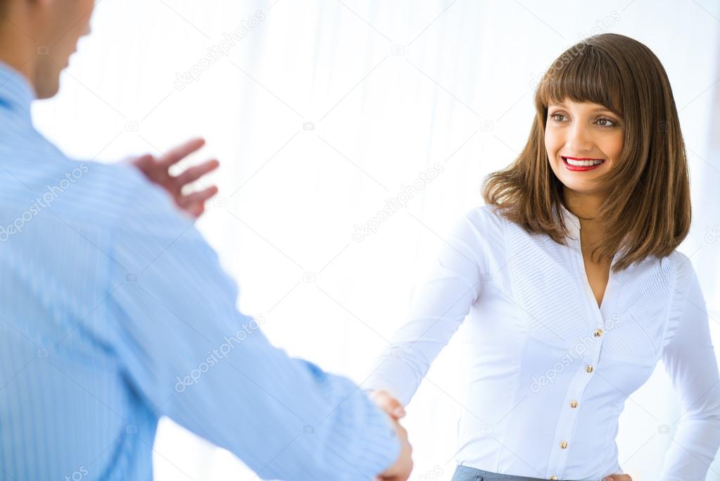 business woman shaking hands with a client
