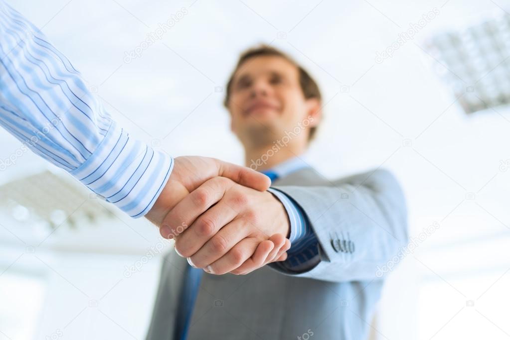businessman shaking hands with a colleague