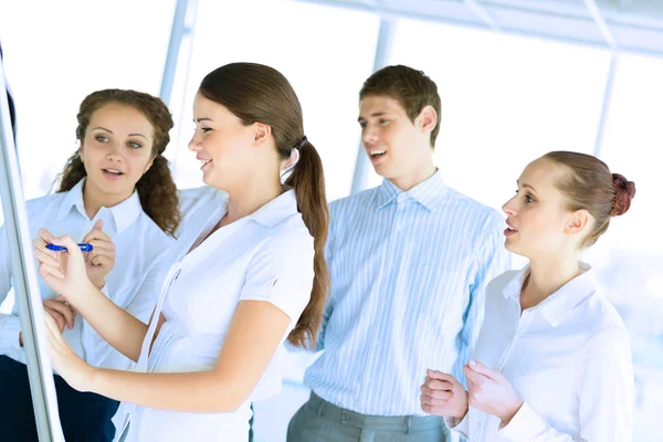 Businessmen are meeting near the flipchart — Stock Photo, Image