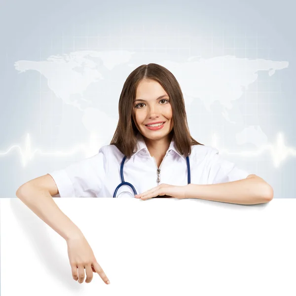 Young woman doctor with a blank banner — Stock Photo, Image