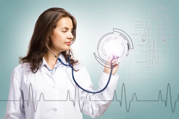 Doctor put a stethoscope to the glowing dashboard — Stock Photo, Image