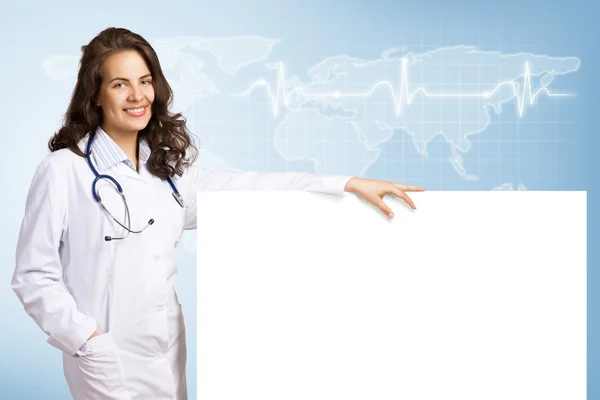 Young woman doctor with a blank banner — Stock Photo, Image