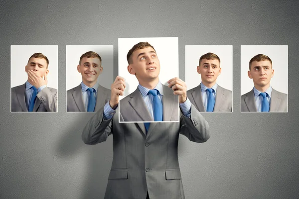 Young man holds up a photograph — Stock Photo, Image