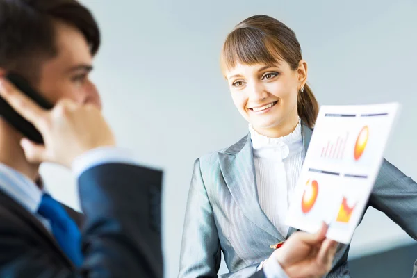 Two business partners discussing reports — Stock Photo, Image