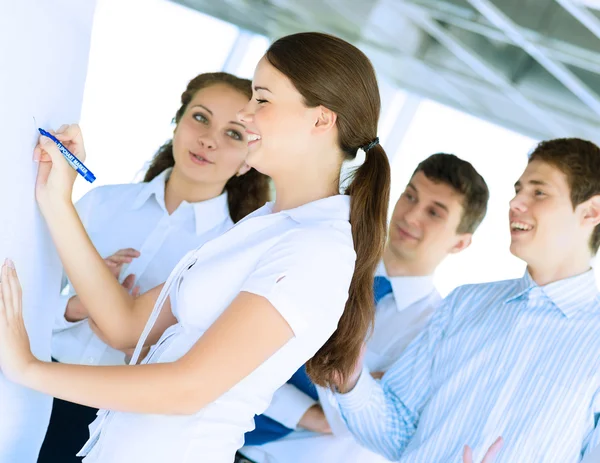 Businessmen are meeting near the flipchart — Stock Photo, Image