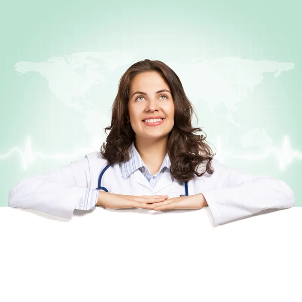 Genç kadın doktor boş bir afiş — Stok fotoğraf