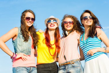 group of young people wearing sunglasses and hat