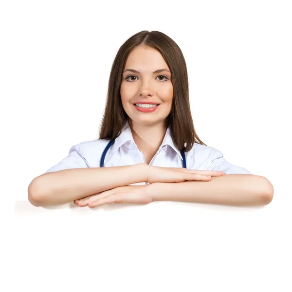 Young woman doctor with a blank banner — Stock Photo, Image