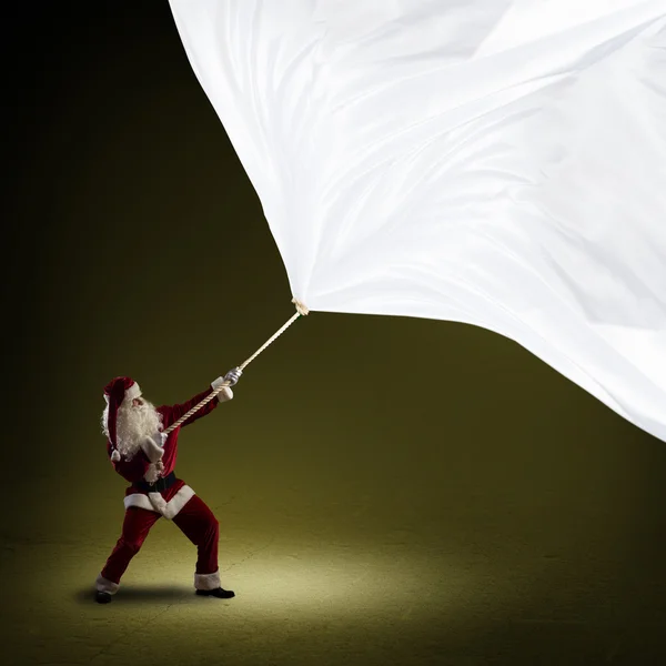 Άγιος Βασίλης τραβά το banner — Φωτογραφία Αρχείου