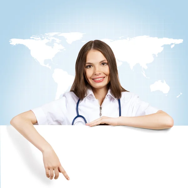 Young woman doctor with a blank banner — Stock Photo, Image