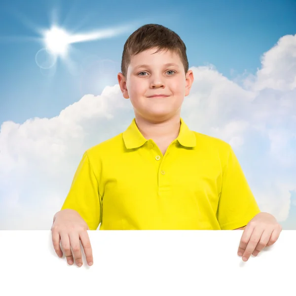 Boy holding a white banner — Stock Photo, Image