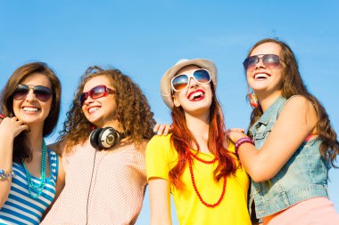 group of young people wearing sunglasses and hat