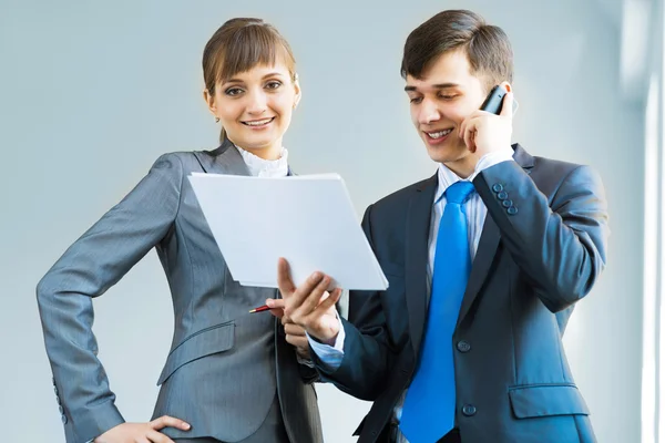 Two business partners discussing reports — Stock Photo, Image