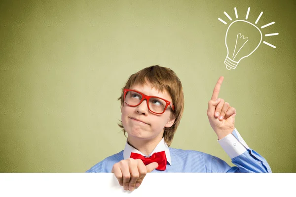 Boy holding a white banner — Stock Photo, Image