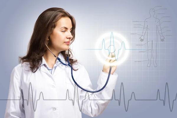 Doctor put a stethoscope to the glowing dashboard — Stock Photo, Image