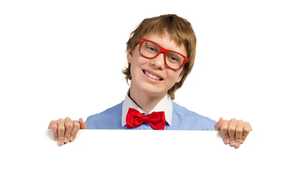Boy with glasses holding a white placard — Stock Photo, Image