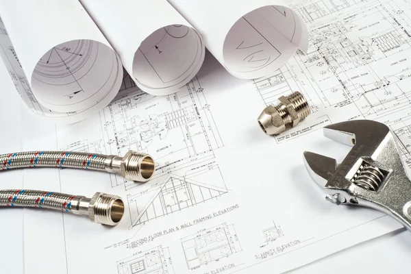 Plumbing and drawings, construction still life — Stock Photo, Image