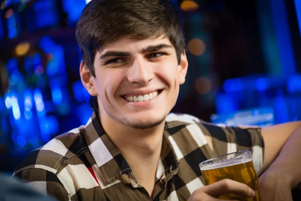 Young man at the bar — Stock Photo, Image