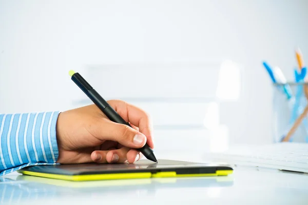 Man's hand with a pen stylus — Stock Photo, Image