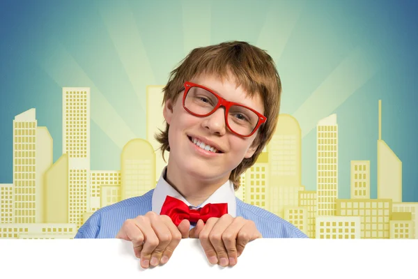 Boy holding a white banner — Stock Photo, Image