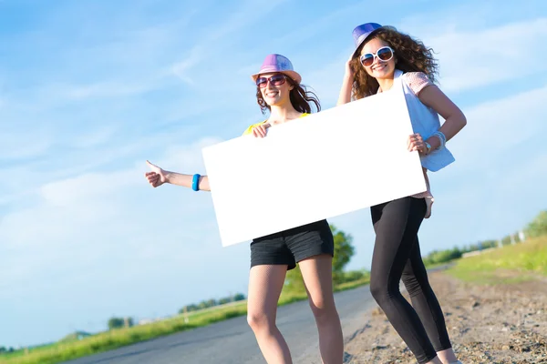 Women with a blank banner — Stock Photo, Image