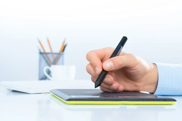 Designer hand on the tablet — Stock Photo, Image