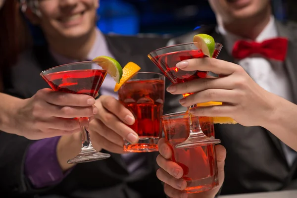 Close-up of hands with glasses — Stock Photo, Image