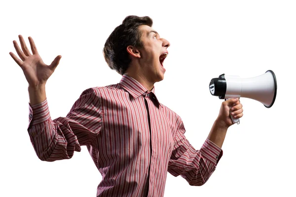 Young man shouting using megaphone Stock Image