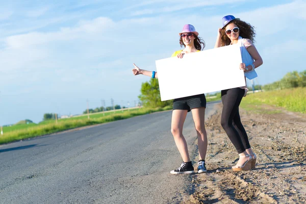 Women with a blank banner — Stock Photo, Image