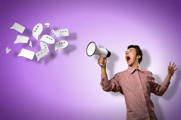 Man yells into a megaphone — Stock fotografie