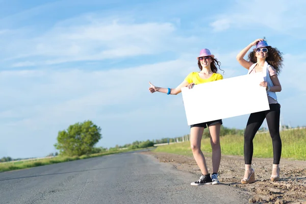 Women with a blank banner — Stock Photo, Image