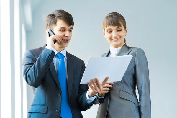 Two business partners discussing reports — Stock Photo, Image