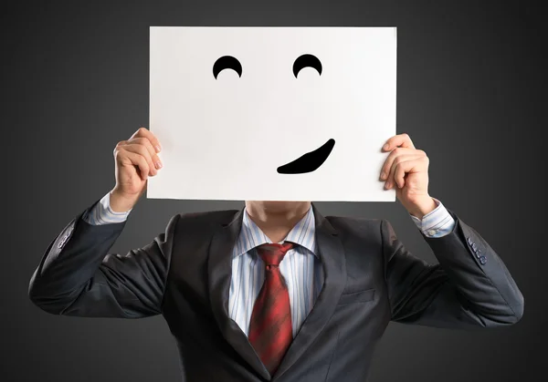 Business man holding a poster — Stock Photo, Image