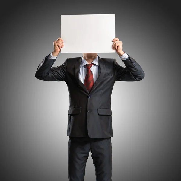 Business man holding a poster — Stock Photo, Image