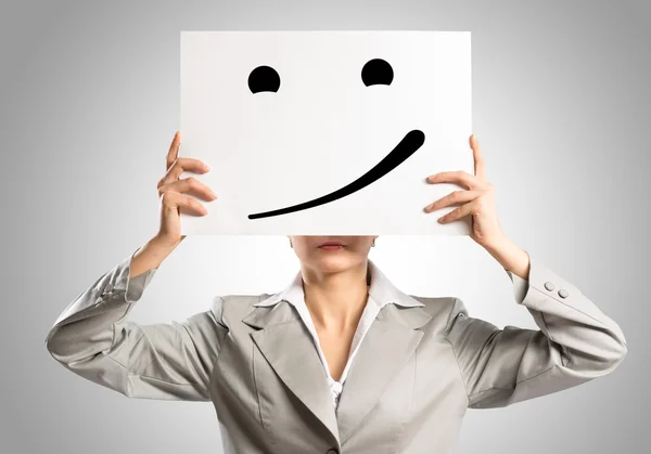 Business woman holding a poster — Stock Photo, Image